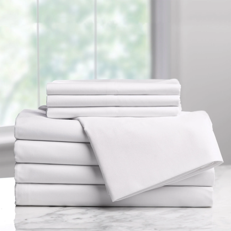 Stacked premium cotton bedding sets manufactured by Velara Textiles